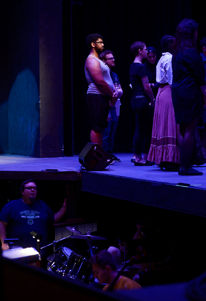 Professor Marc Vital II, in charge of costumes for Ragtime, listens to a cast meeting